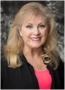 Patricia Bookstaver wearing a black jacket over a bright top