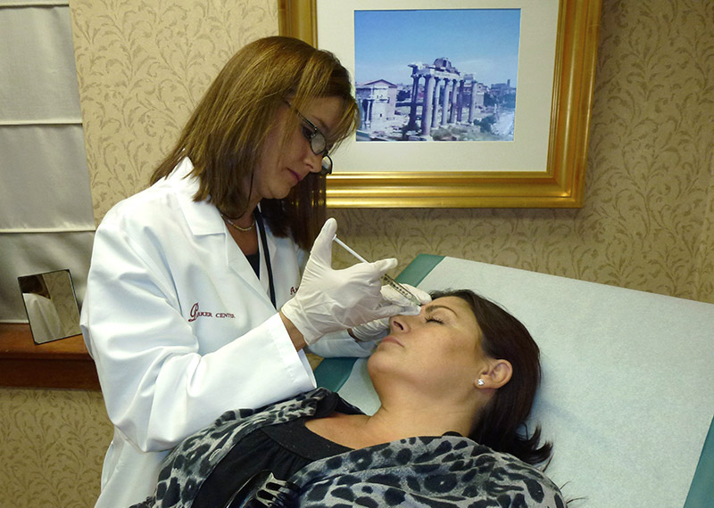 Nurse Angela making an injection into a patients brow area