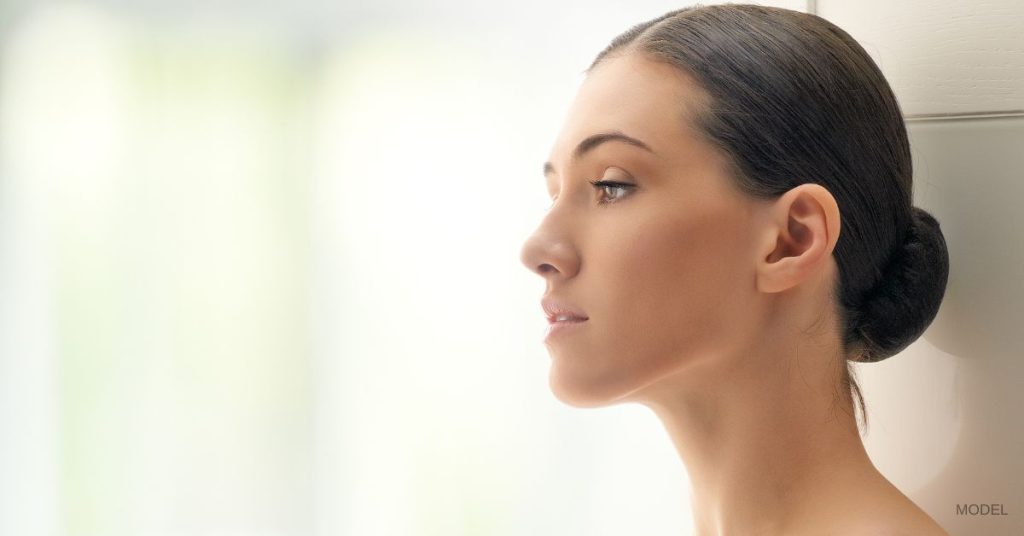 Woman with a balanced facial structure (model) profile shown looking forwards.
