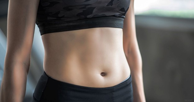 close up of a woman’s midsection (model)